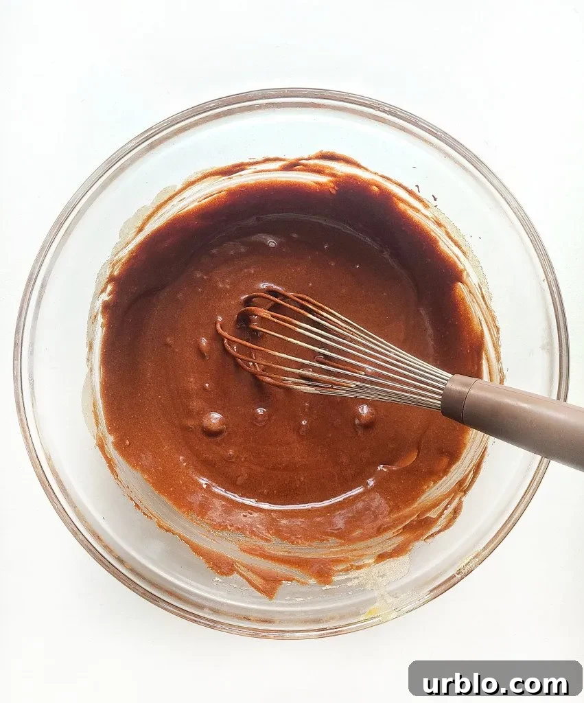 add in the melted chocolate and vanilla