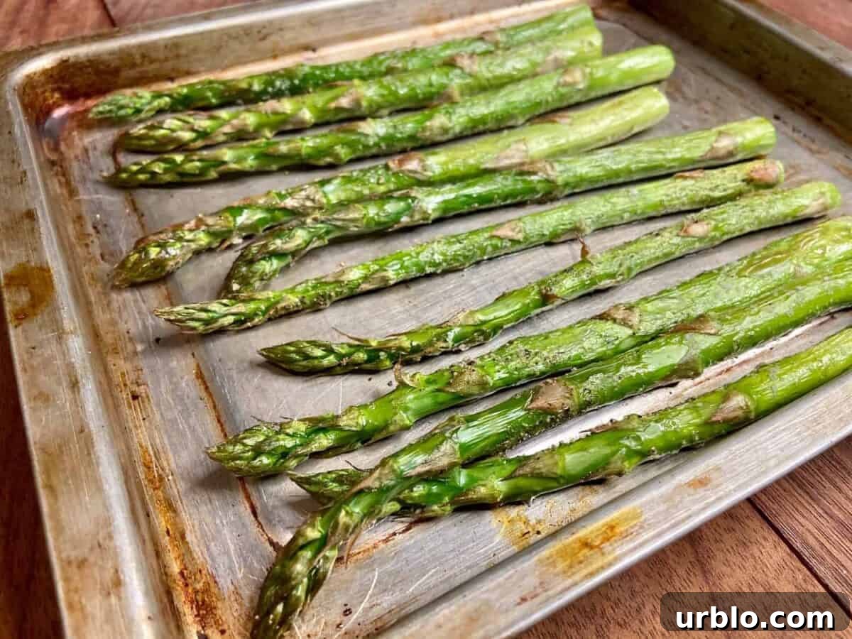 Roasted carrots on a baking sheet.