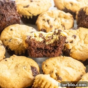 Decadent Brookie Bites Recipe: Chocolate Brownie + Cookie Bars 18 brookie bites piled up with one missing a bite