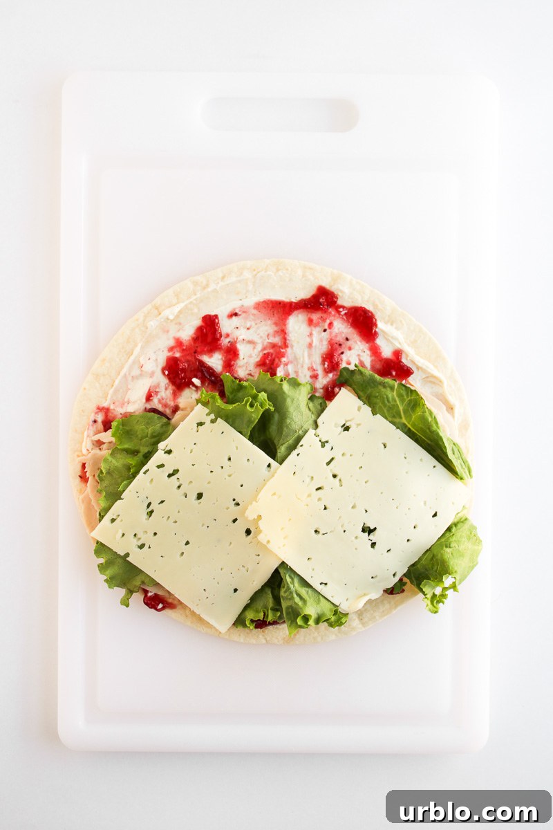 Cold Turkey and Cranberry Pinwheels for Leftovers 9 Lettuce and cheese is added to the top of the tortilla.