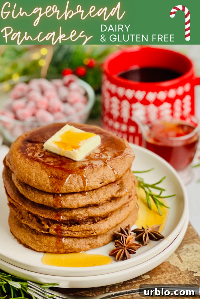 A white plate filled with dark brown pancakes topped with melting butter and syrup.