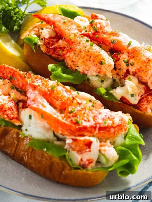 Lobster rolls with juicy, tender lobster meat on a toasted bun.