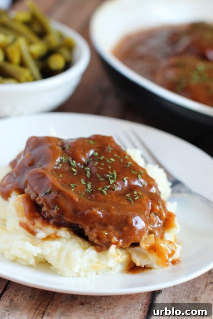 mashed potatoes topped with salisbury steak