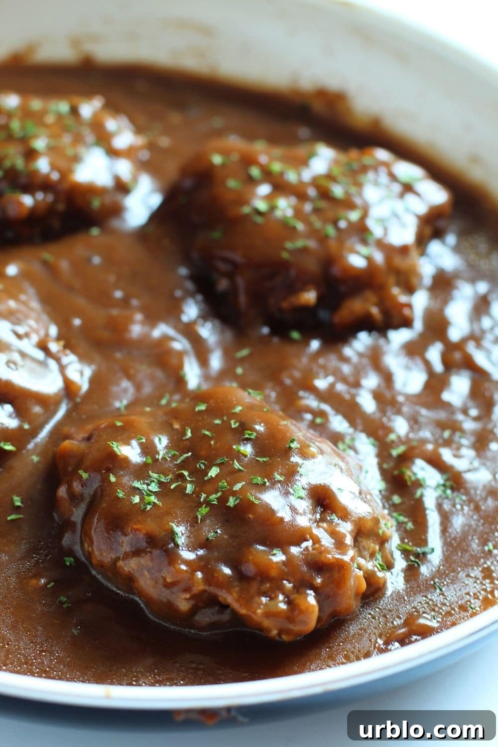 pan with salisbury steak in it