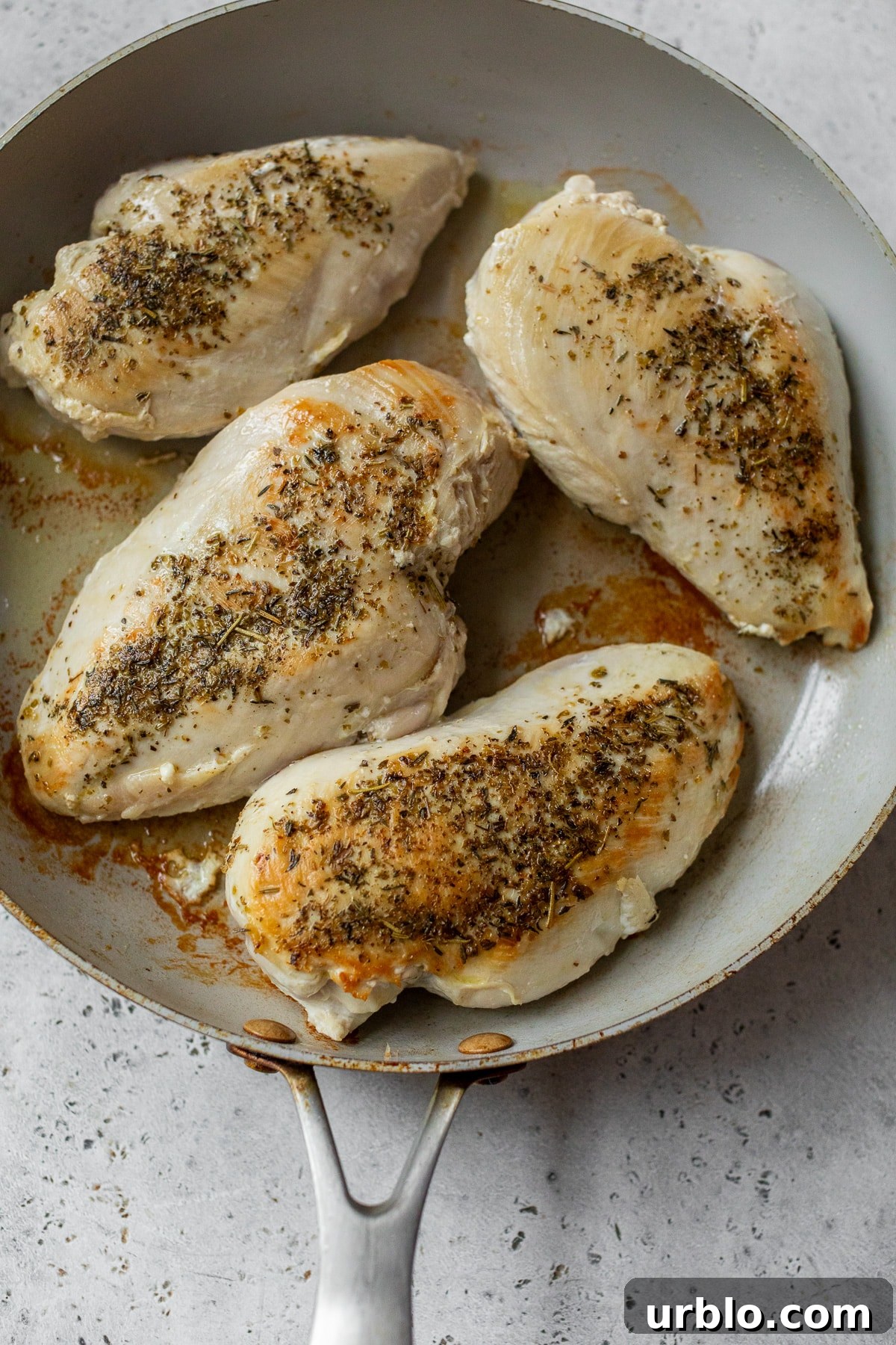 chicken searing in a skillet