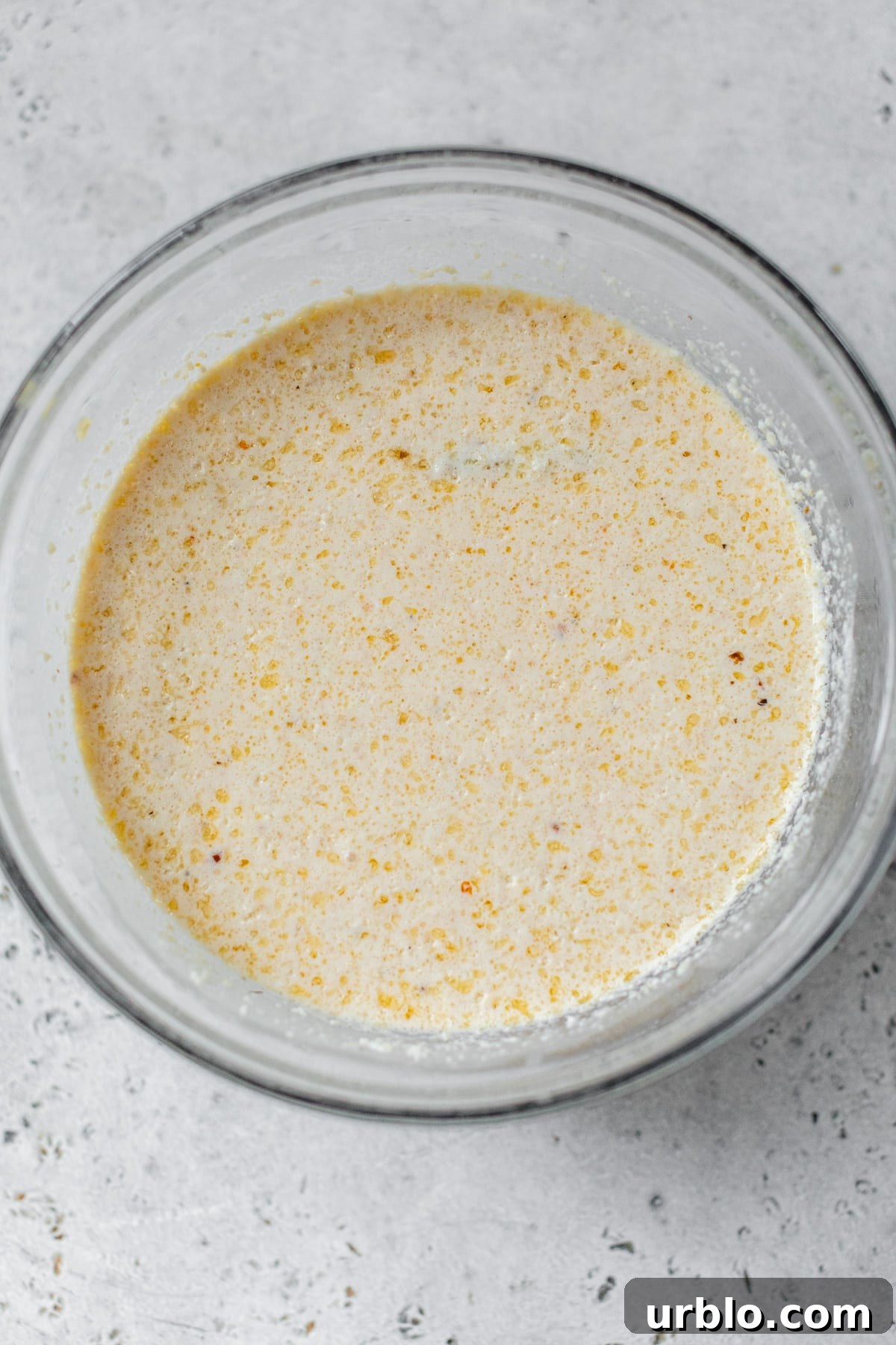 all sauce ingredients combined in a glass bowl