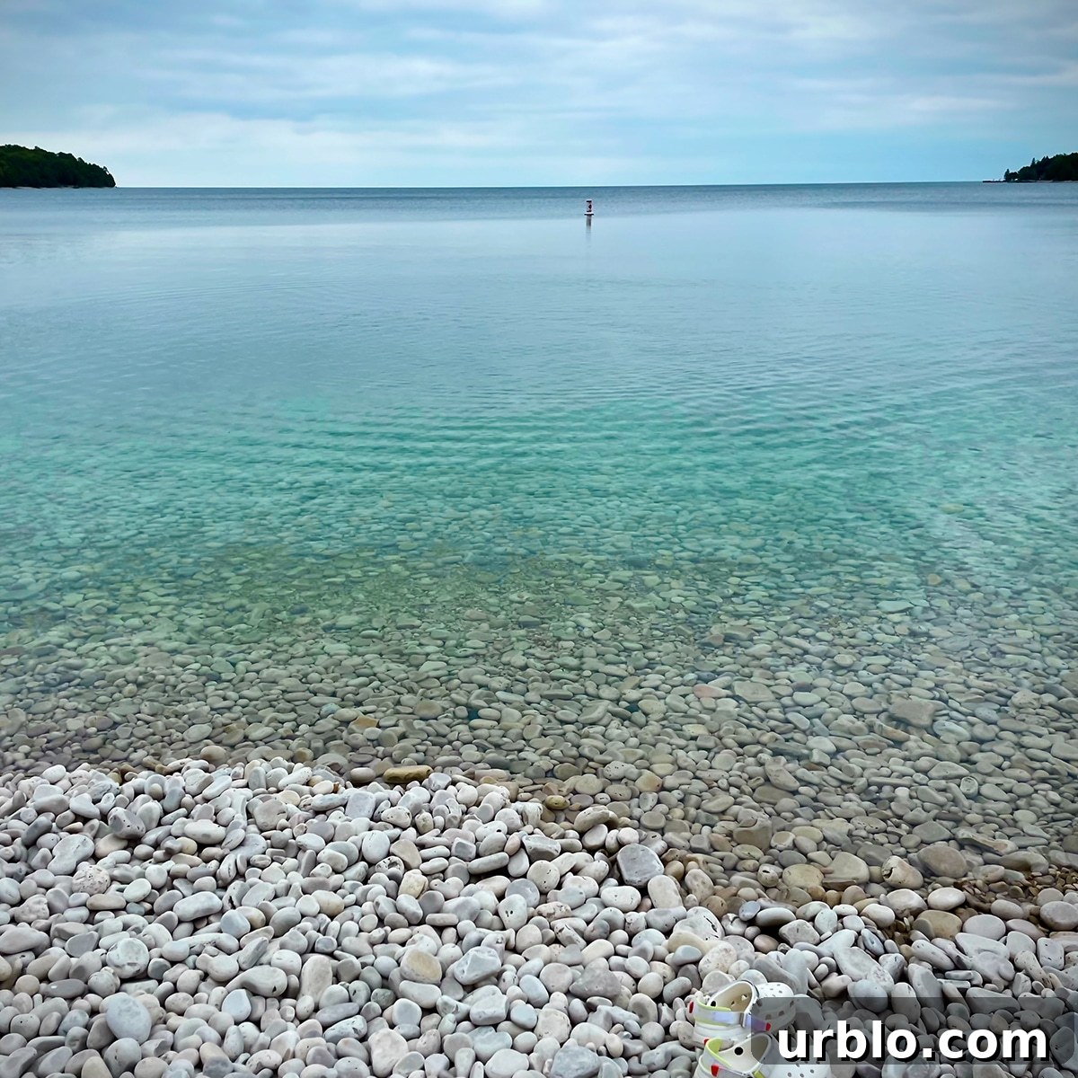The smooth rocks and clear waters of Schoolhouse beach on Washington Island.