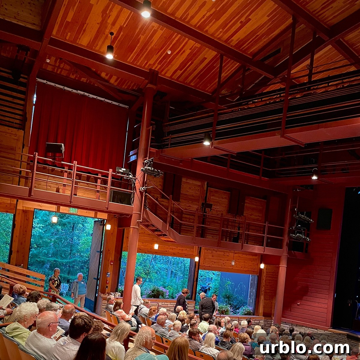 Inside the Peninsula Players Theater with the doors and walls open to the surrounding forest.
