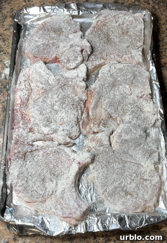 Crispy Fried Pork Chops with Homemade Pan Gravy 9 dredged and seasoned pork chops