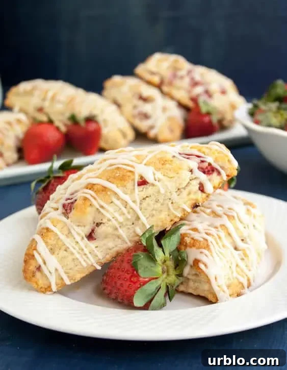 Two Fresh Strawberry Cream Scones on a plate