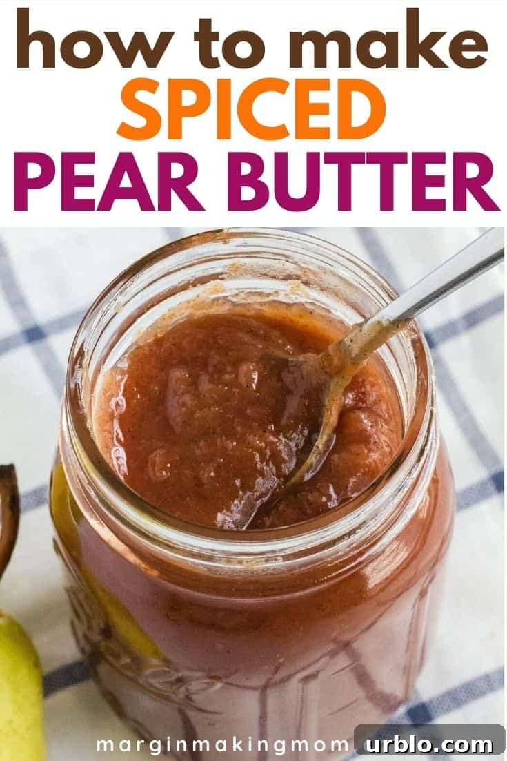 jar of pear butter with a spoon in it