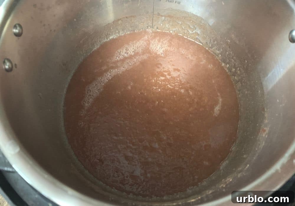 pureed pear butter in the cooking pot
