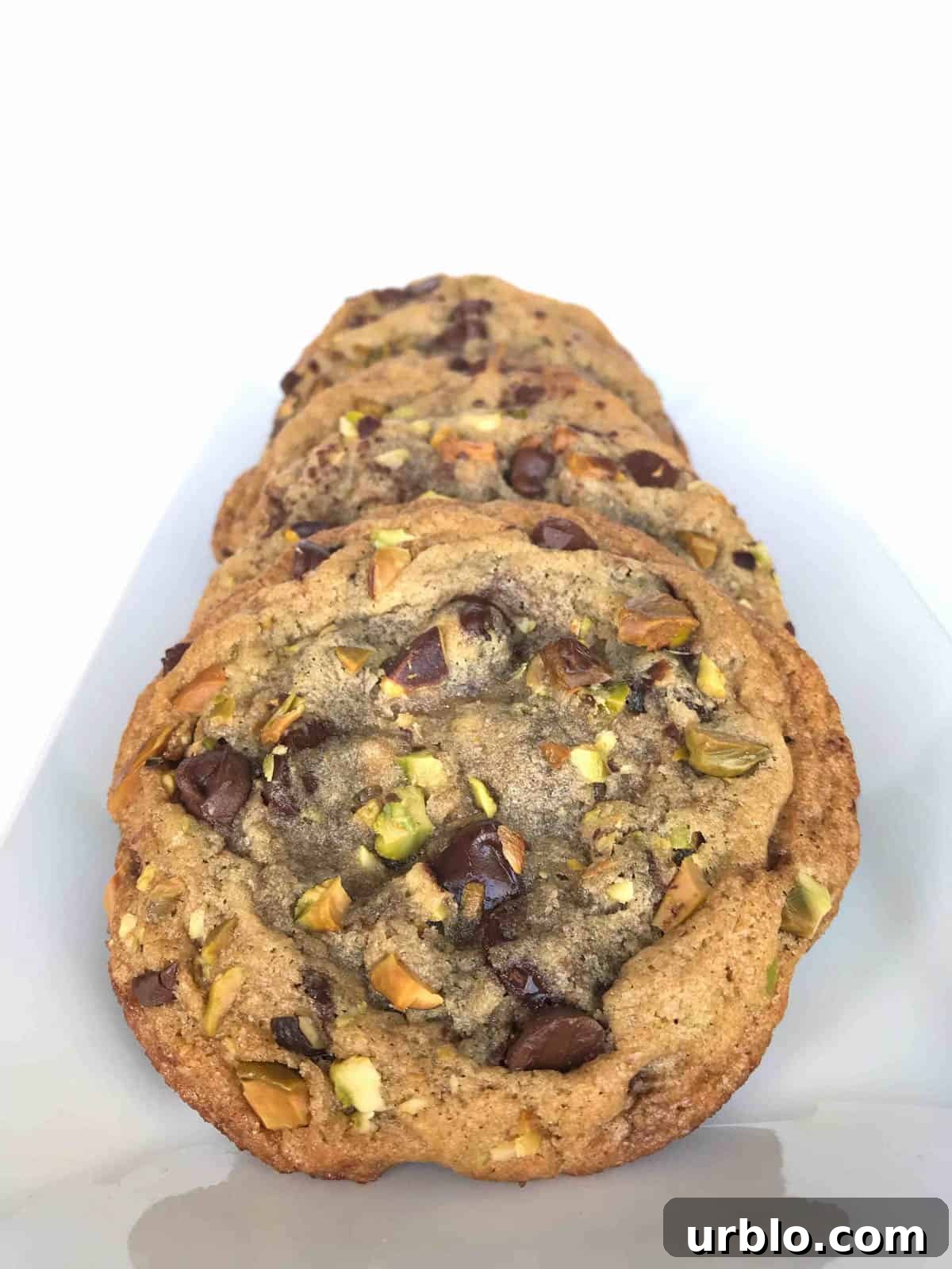 stack of dark chocolate pistachio cookies. 