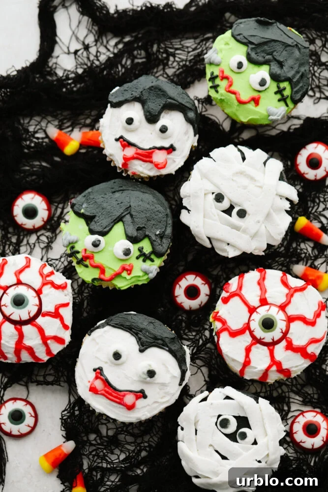 Various Halloween cupcakes served on black netting.