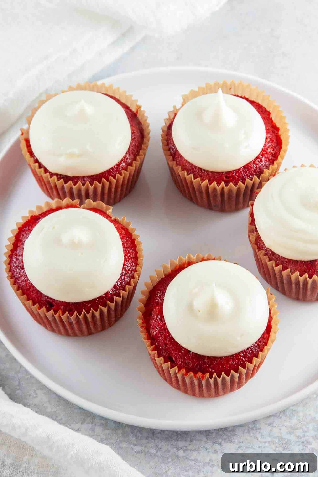 A plate with 5 Red Velvet Cupcakes