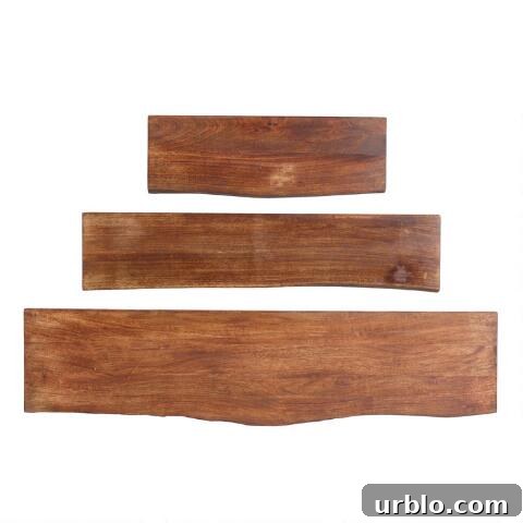three wood floating shelves in different sizes