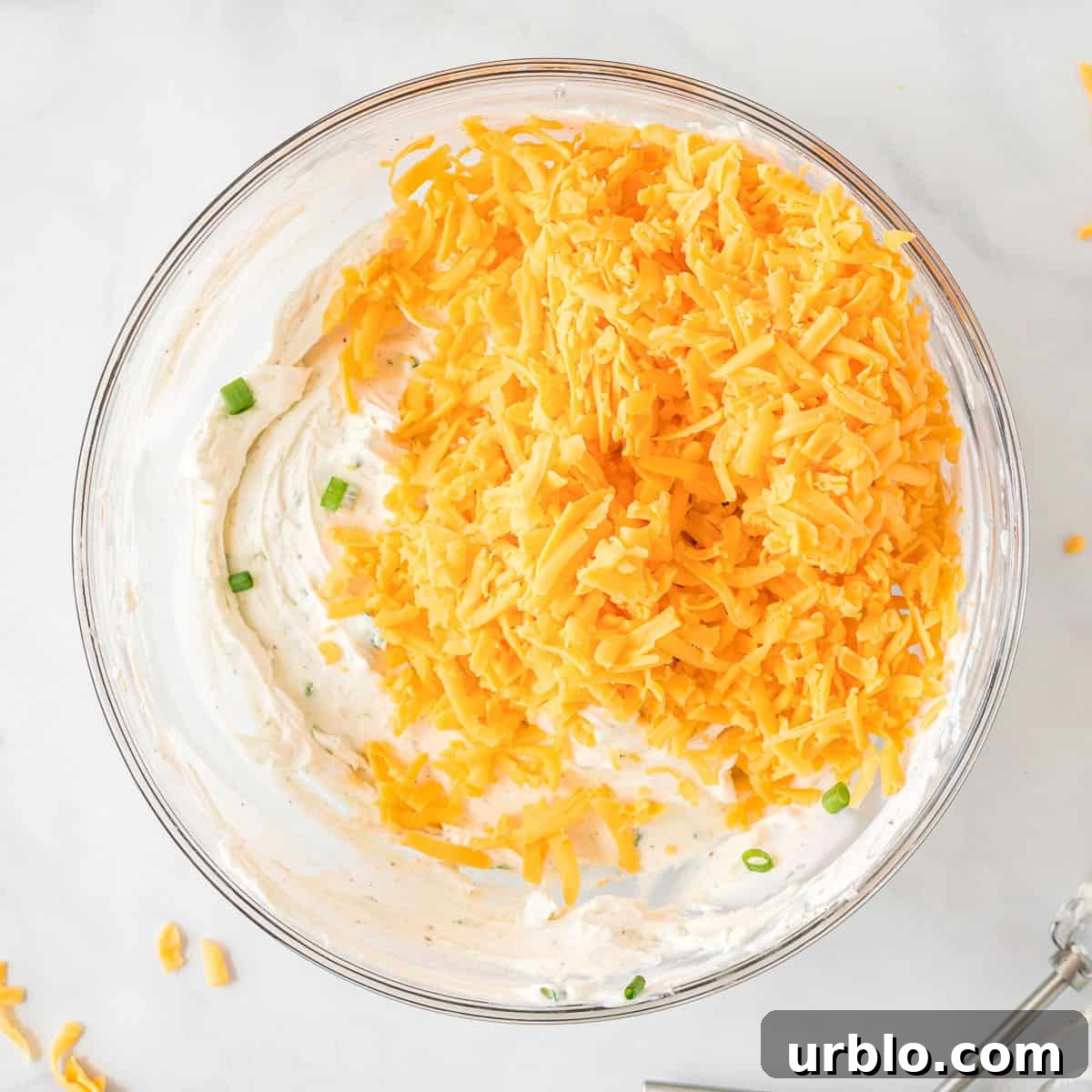 Classic Creamy Cheese Ball Recipe: Party Appetizer Guide 8 shredded cheddar added to the cheese ball ingredients