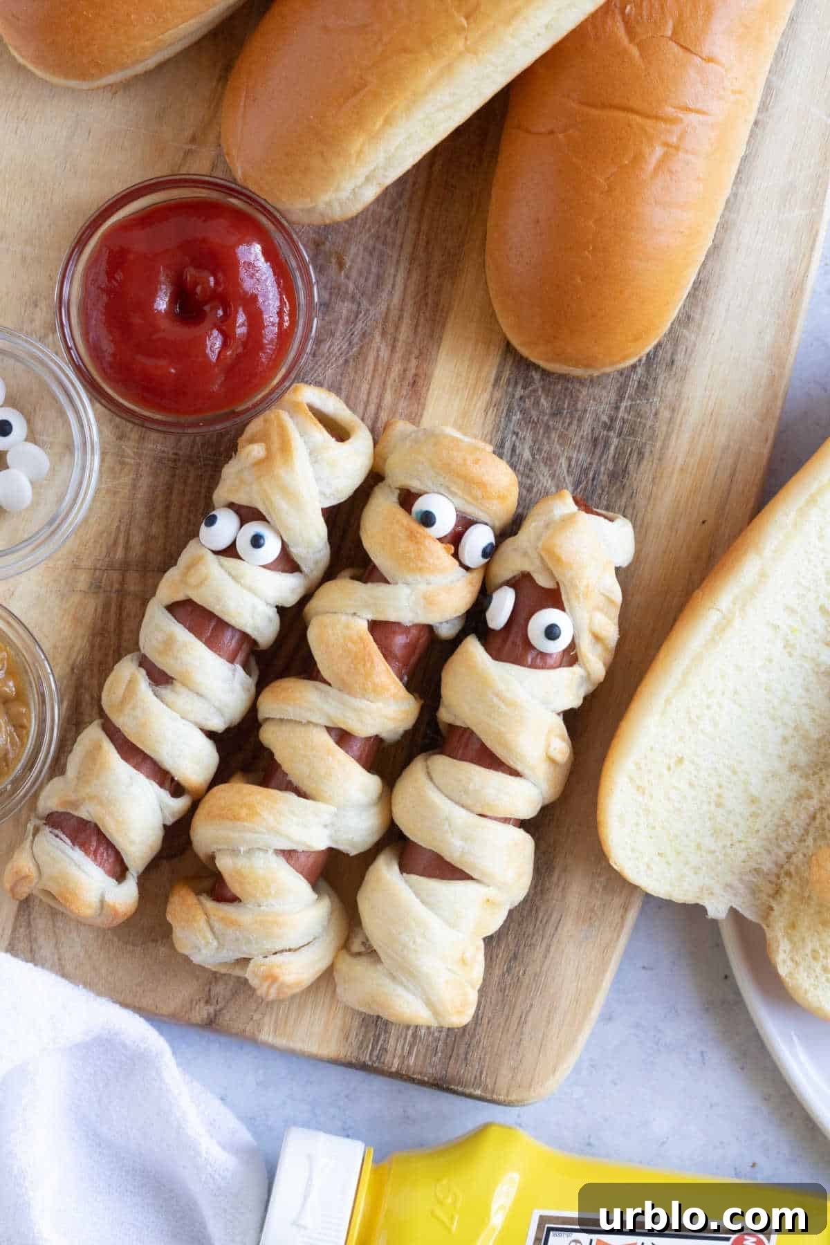Mummy dogs with ketchup dipping sauce.