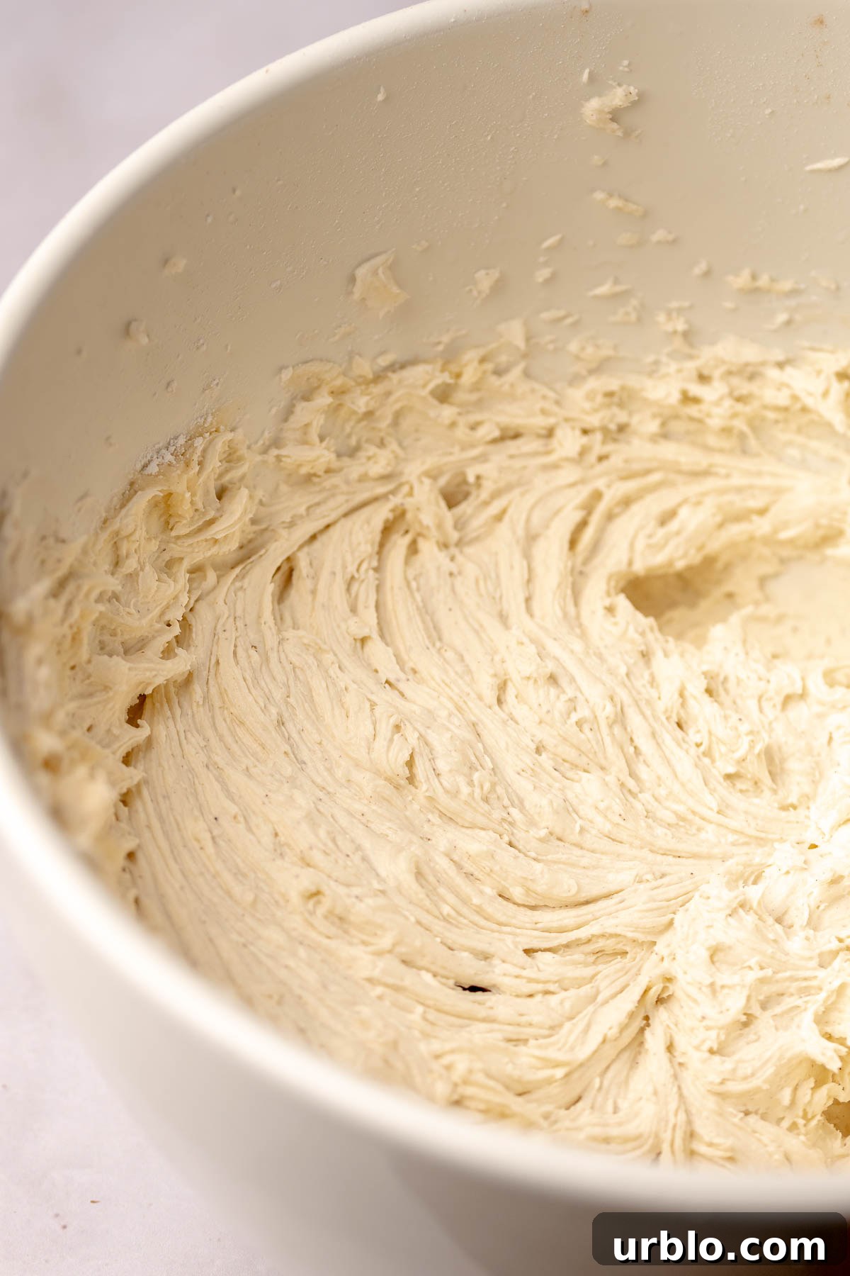 Honey buttercream in a bowl.