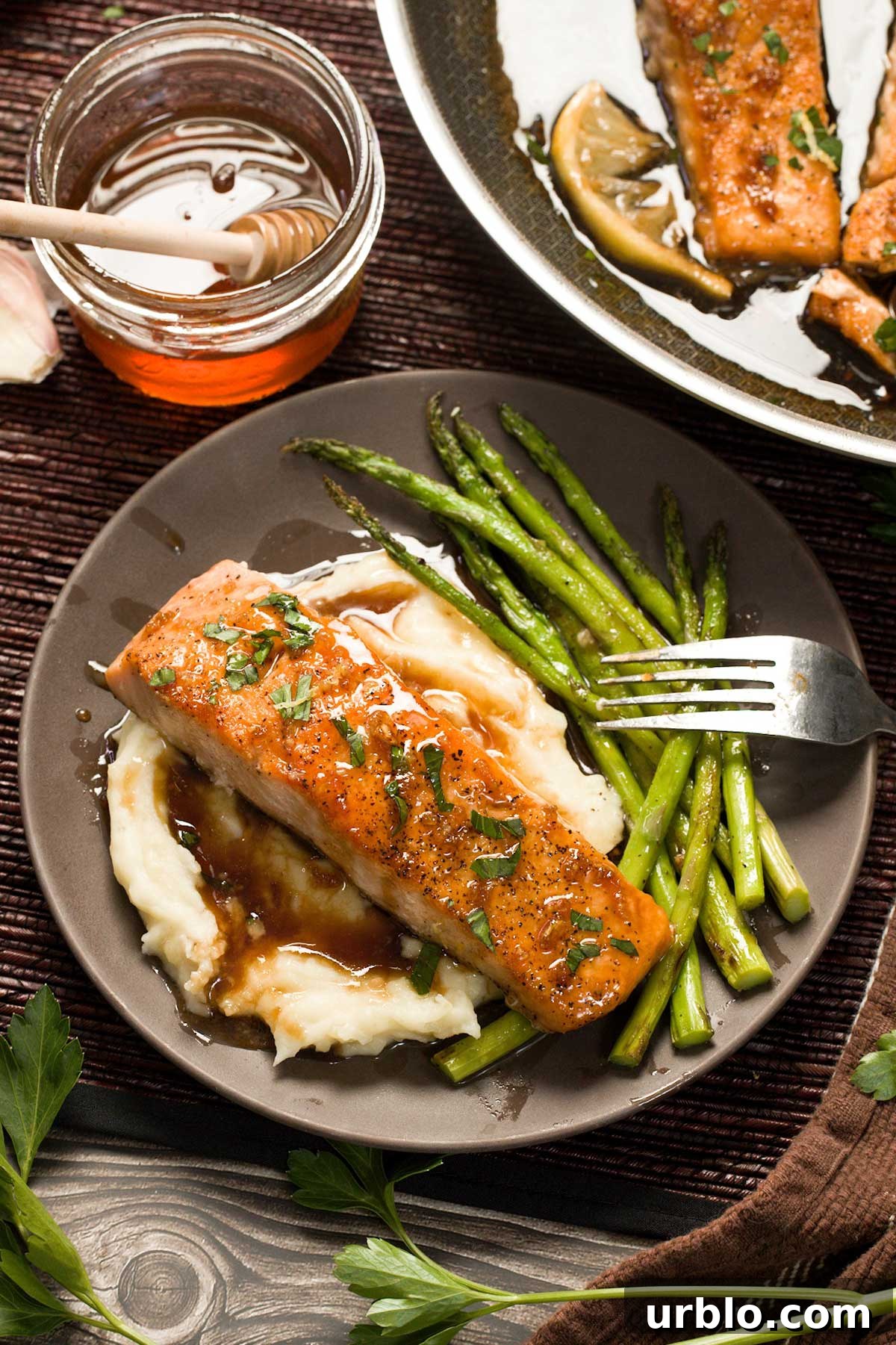 Mashed potatoes, asparagus and salmon on a plate.