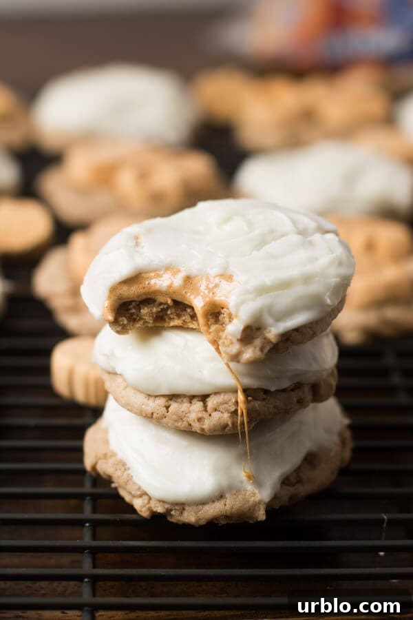 These are going to be your new favorite holiday cookie!! Pumpkin Spice Marshmallow cookies with only 4 ingredients and a cream cheese frosting! ohsweetbasil.com-6