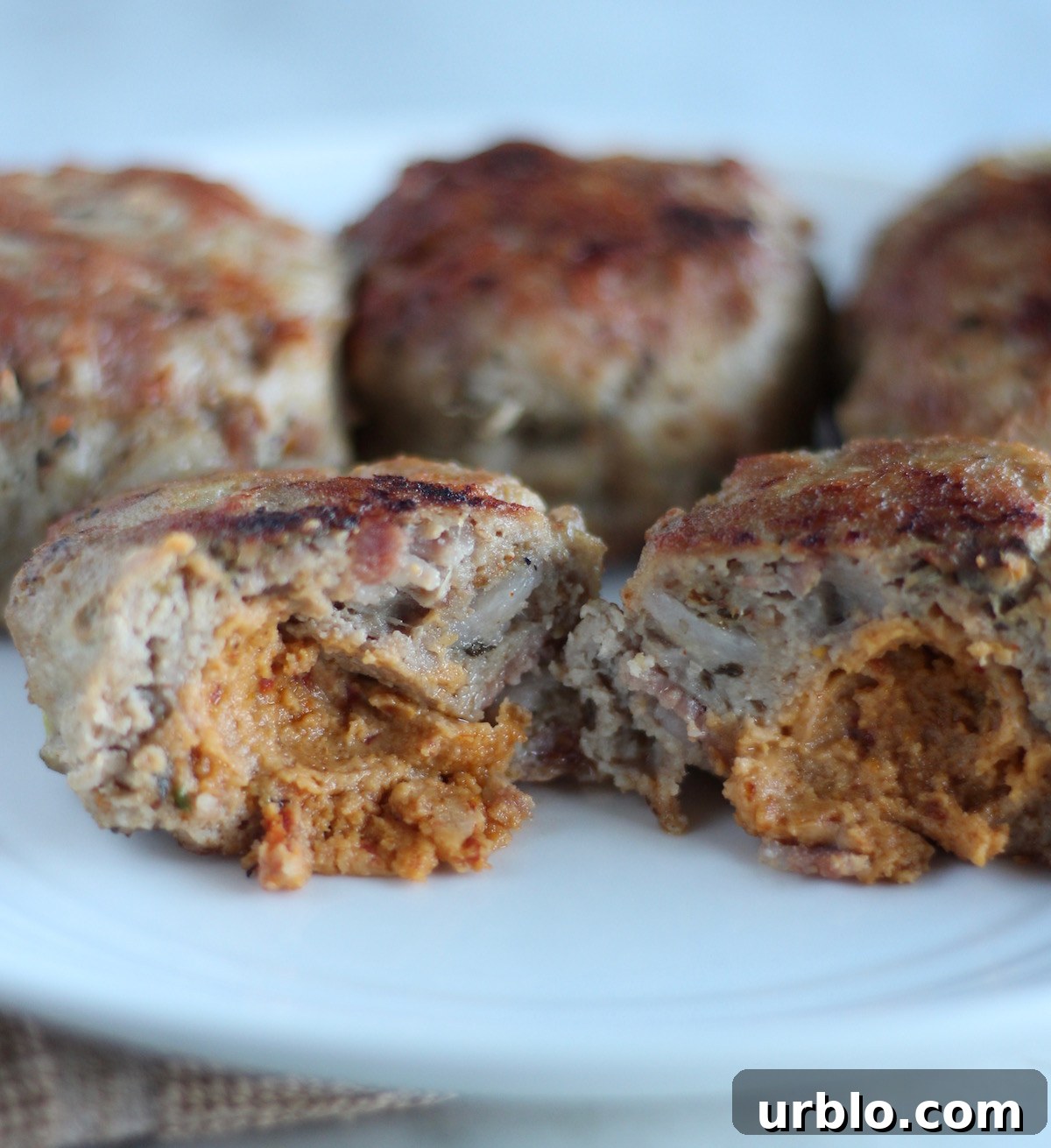 Stuffed Bacon Turkey Burgers - these delicious, paleo turkey burgers are full of bacon, dairy-free cheese, caramelized onions, and slathered with avocado dressing! SO GOOD! | fedandfulfilled.com