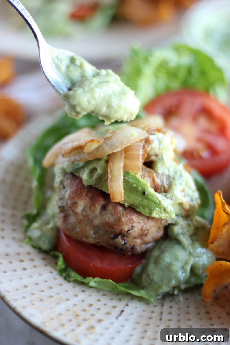 Stuffed Bacon Turkey Burgers - grilled turkey burgers are loaded with bacon and stuffed with cheese, then topped with creamy avocado ranch dressing! OMG! | fedandfulfilled.com