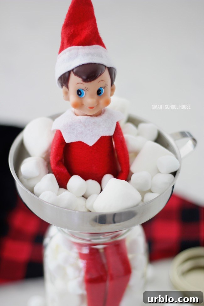 Elf on the Shelf in a Jar of Marshmallows for Christmas.