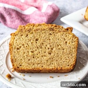 Slices of apple bread of a white plate.