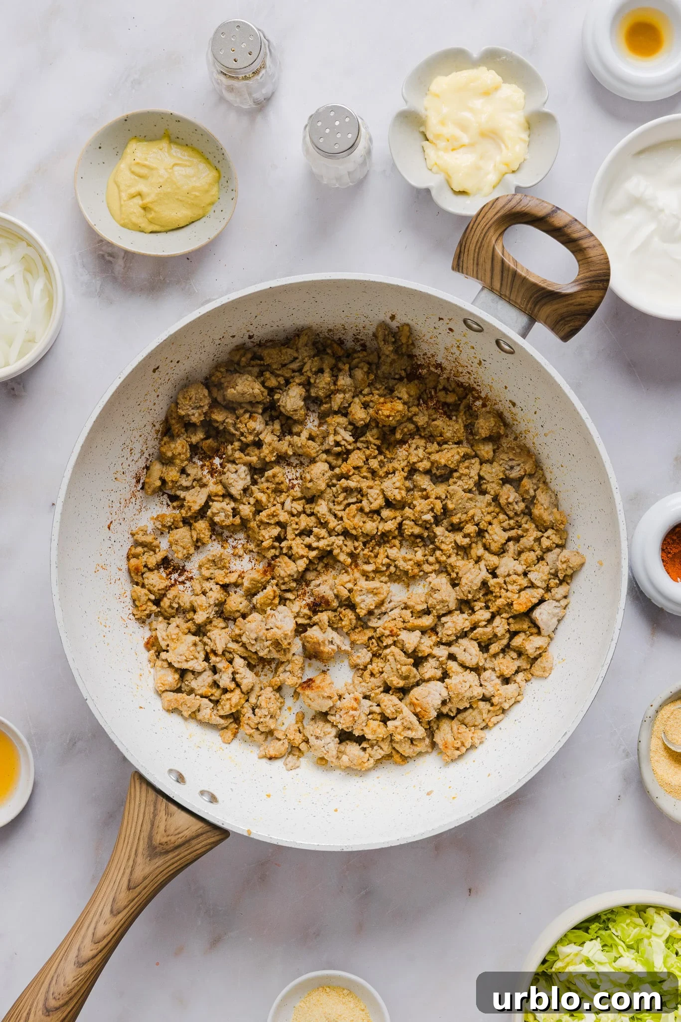 Cooked ground turkey in a frying pan.