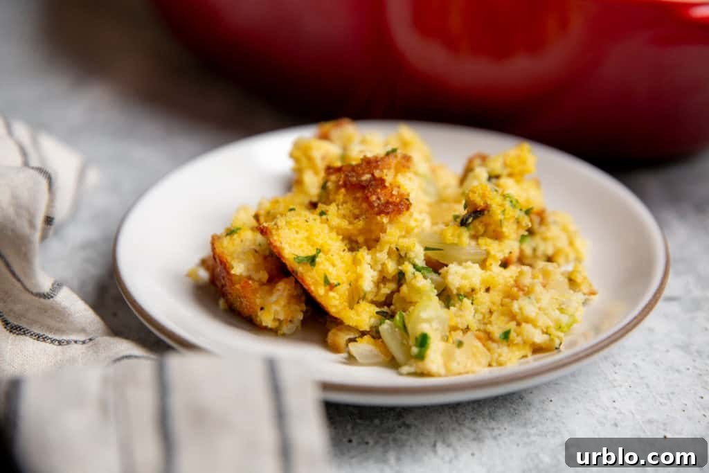 Gluten-Free Cornbread Stuffing Recipe (Cornbread Dressing) 12 A spoonful of cornbread dressing on a plate.