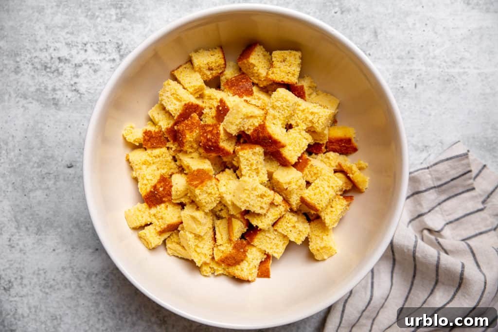 Gluten-Free Cornbread Stuffing Recipe (Cornbread Dressing) 5 Cubed cornbread in a large bowl for the cornbread stuffing recipe.