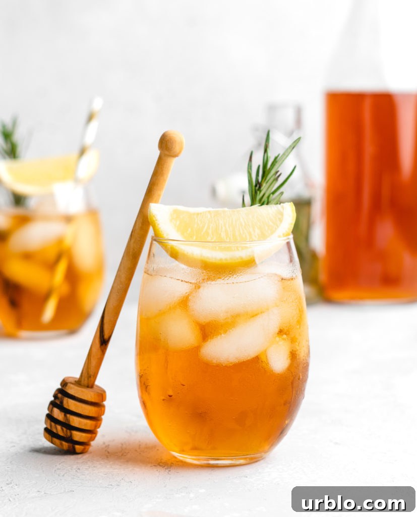 This non-alcoholic iced tea is sweetened with a rosemary honey simple syrup