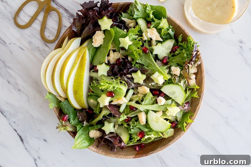 salad with pears pomegranate seeds and cheese chunks
