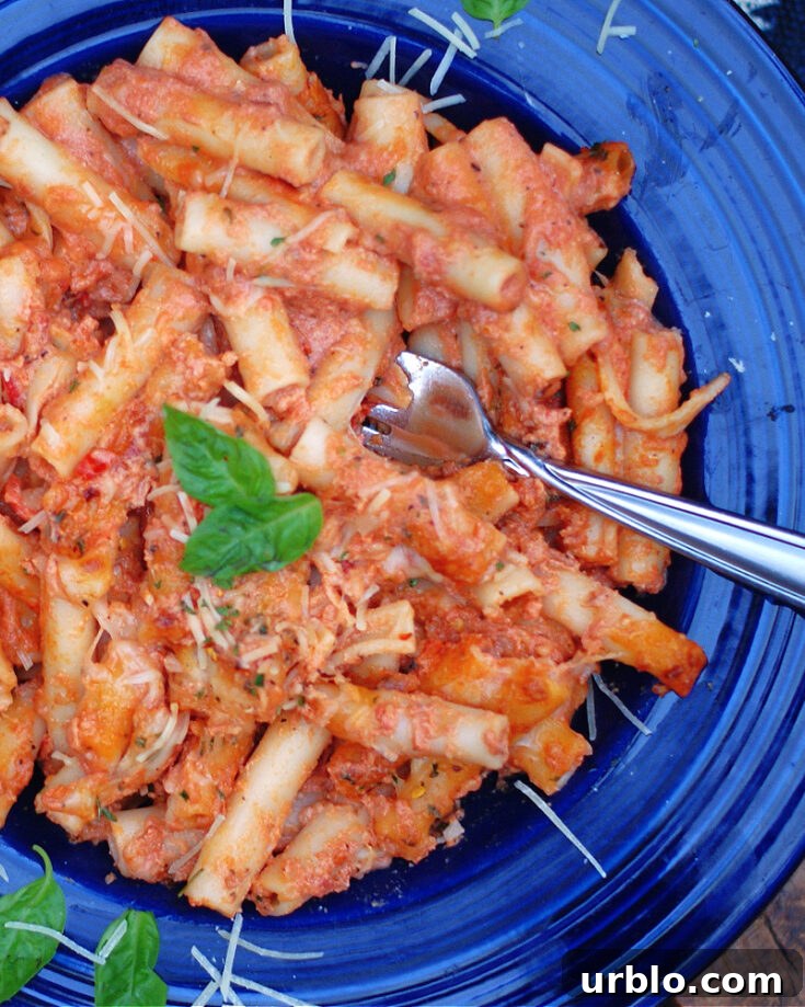 A close up of a bowl baked ziti without ricotta cheese