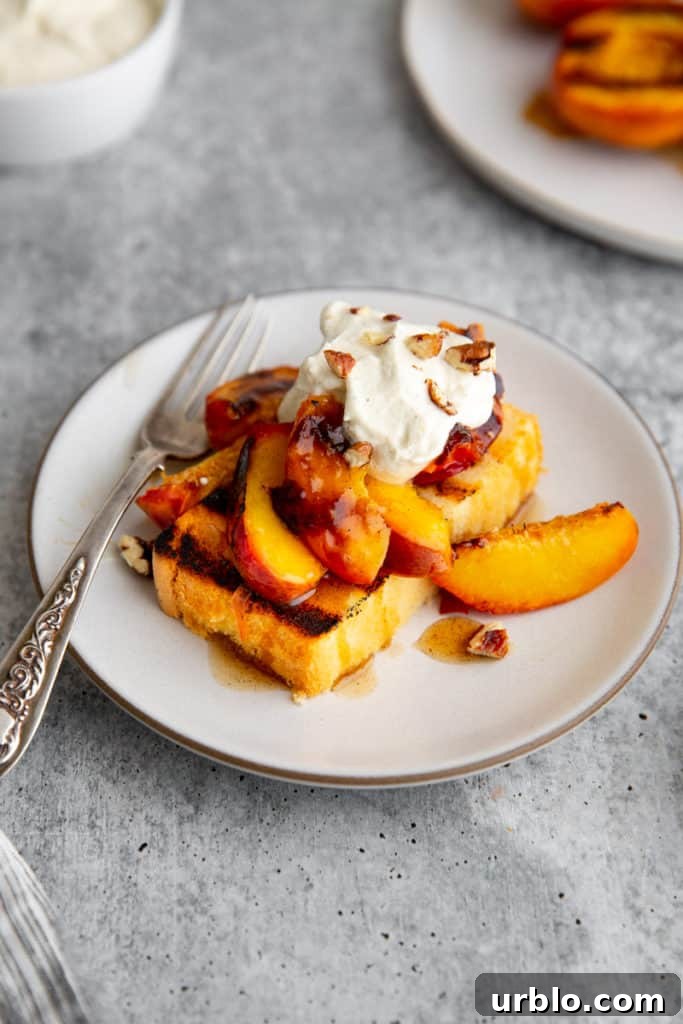Peach shortcake featuring grilled peaches, grilled pound cake and whipped cream. 