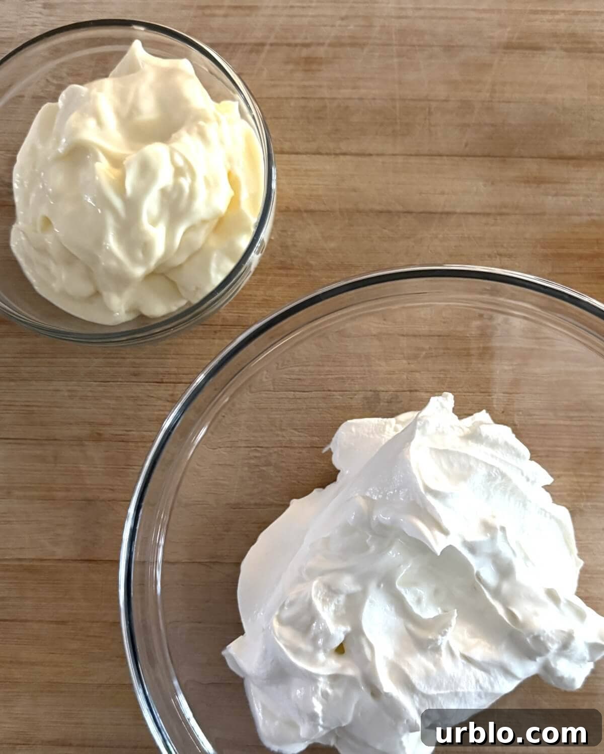 Quick 5-Minute Creamy Dill Dip Recipe for Parties and Snacks 5 A bowl of mayonnaise and a bowl of sour cream.