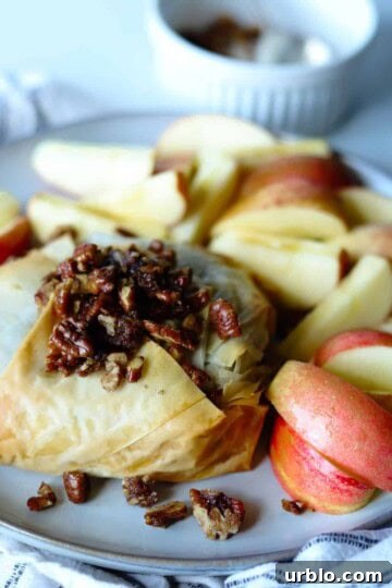 baked brie on plate with side of honey crisp apples
