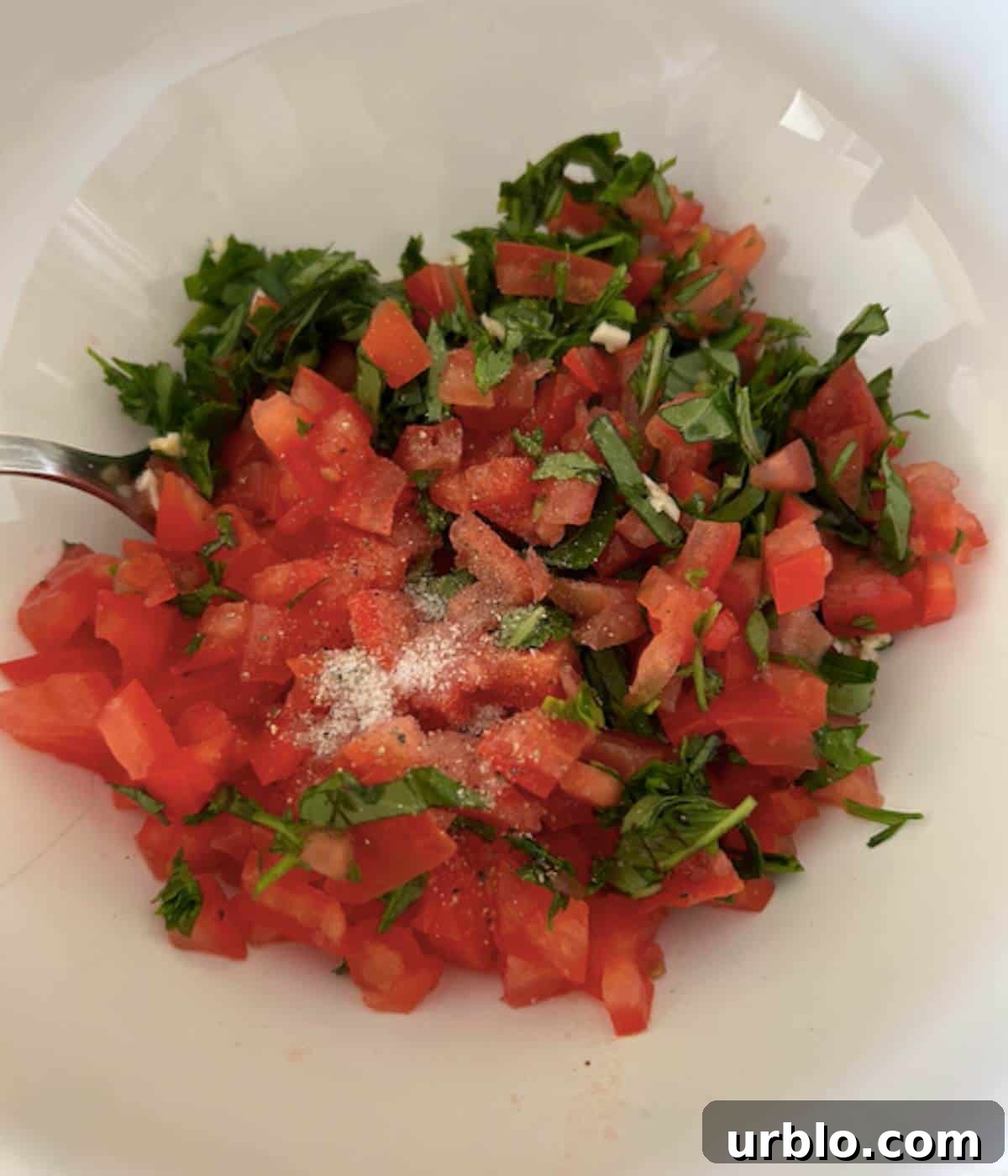 Bruschetta ingredients in bowl.