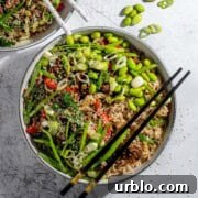 Two beef teriyaki bowls on a white background with chopsticks.