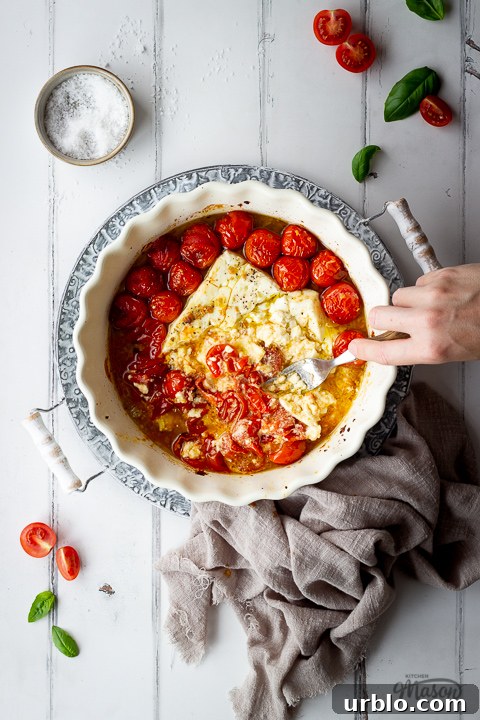 Feta cheese pasta sauce being mixed together with a fork