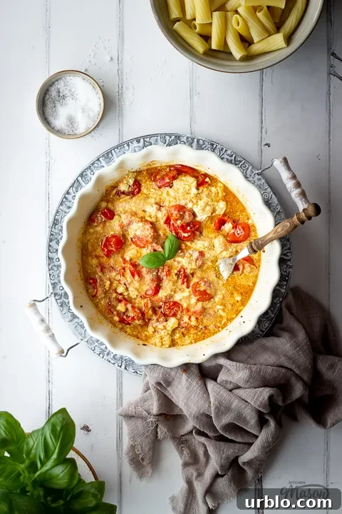 Tomato feta pasta sauce in a dish with a fork