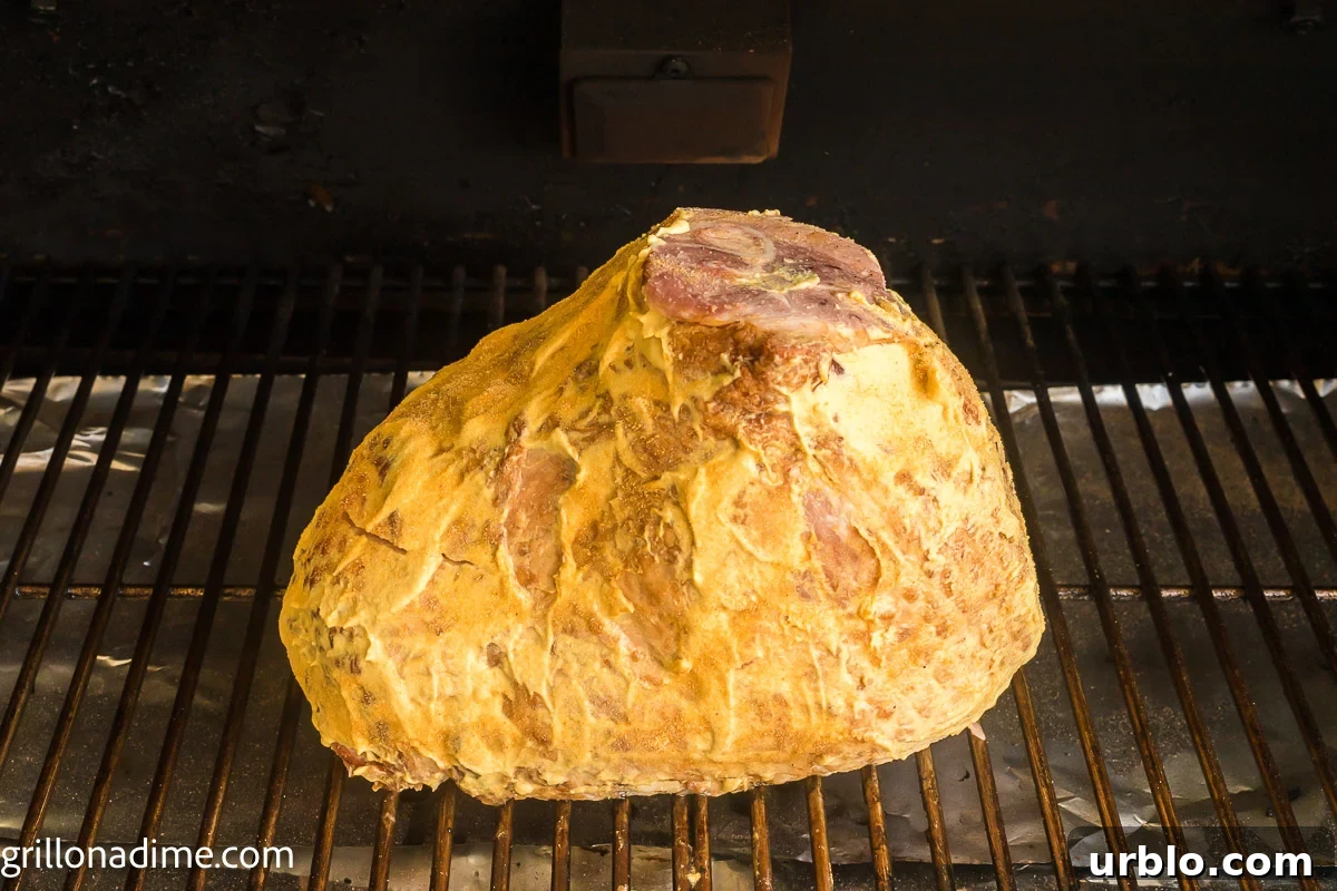 Placing ham in the smoker