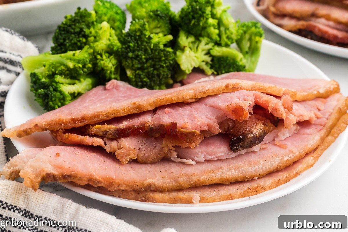 Slice smoked ham on a plate with broccoli