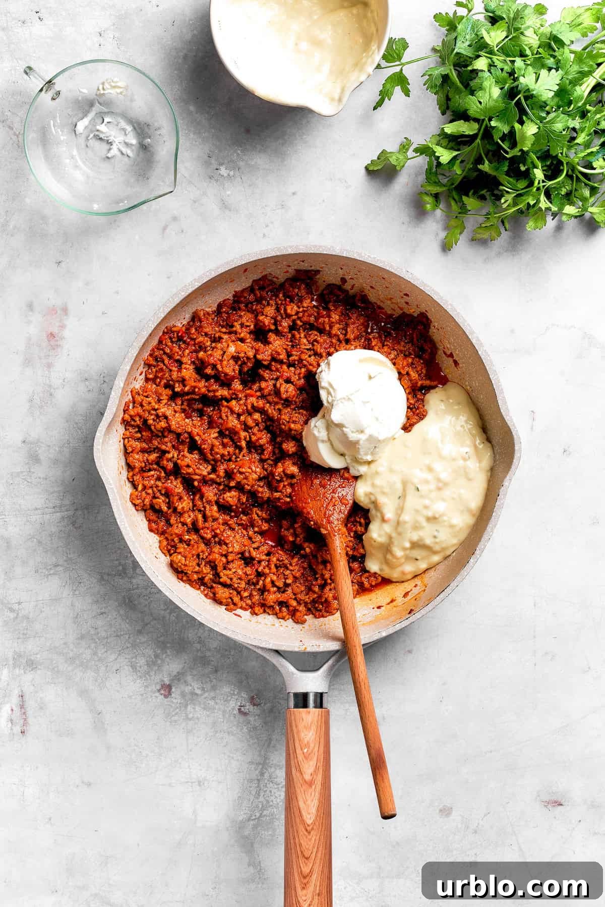 Sour cream and cream soup is added to beef filling.