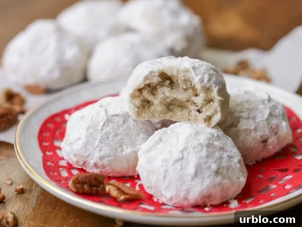 Snowball cookies on a plate.