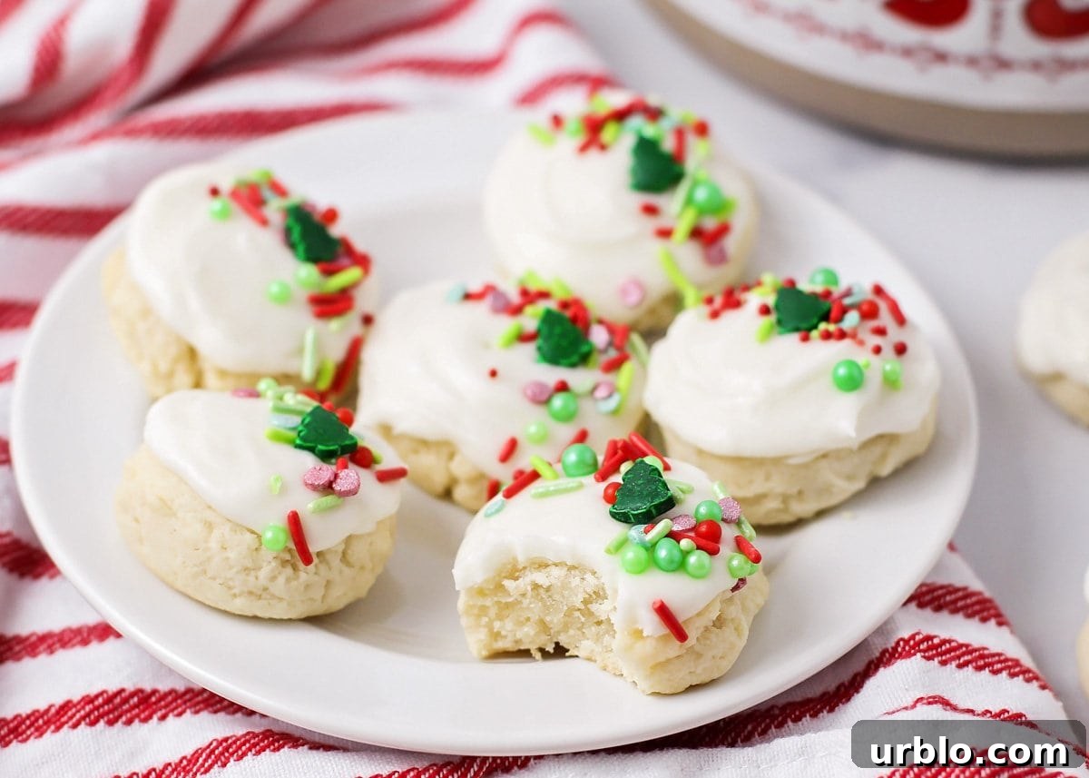 Close up of a plate of Santa cookies with one missing a bite.