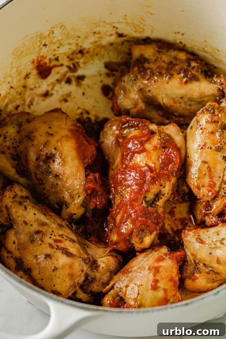 Adding ketchup to chicken after it's cooked.