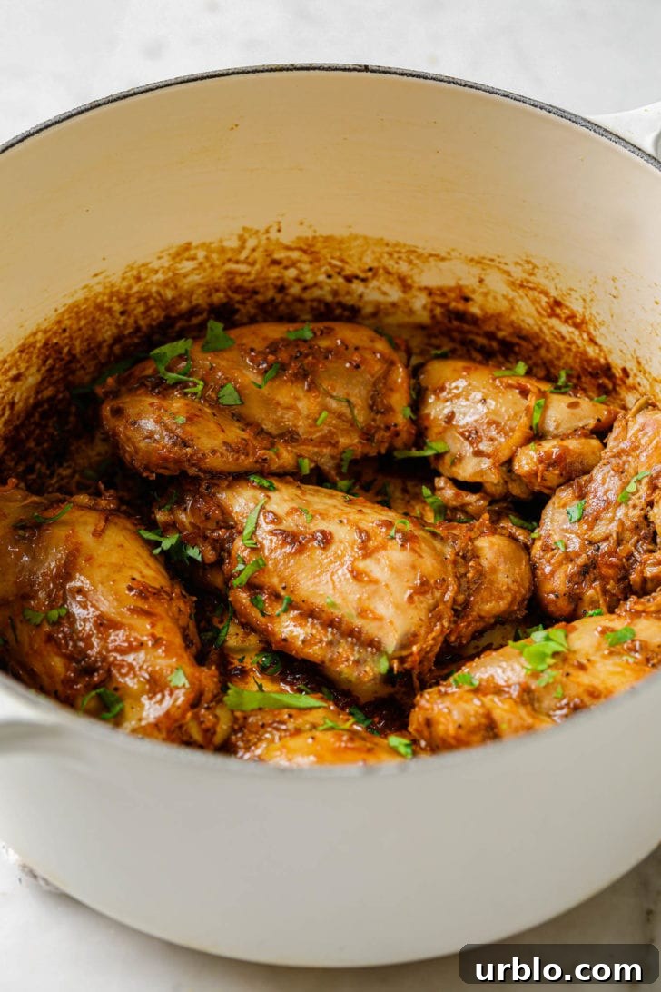 Bone-in Chicken Thighs in a white Dutch oven
