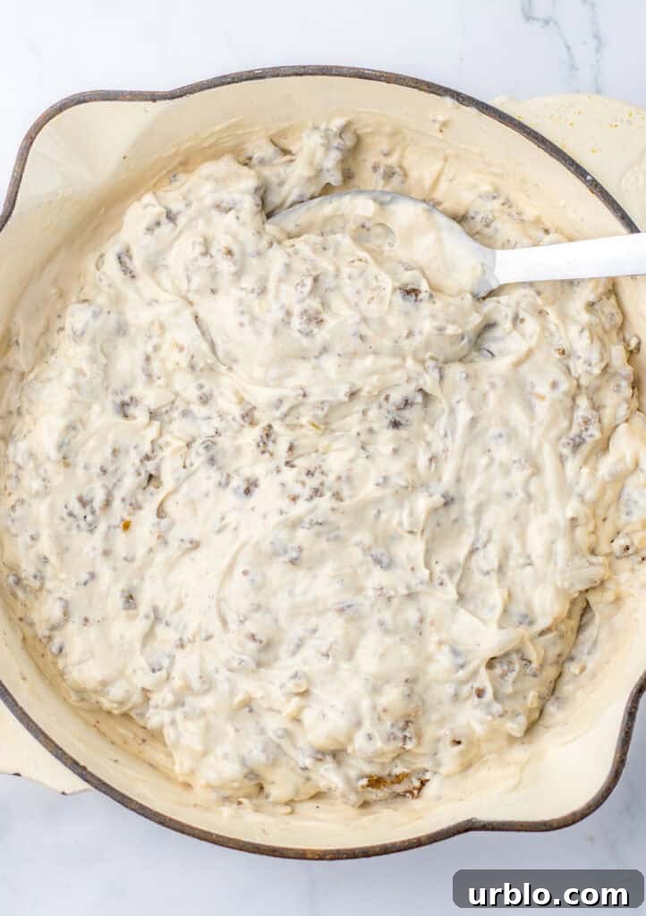mixing ground beef with sour cream and cream of mushroom soup